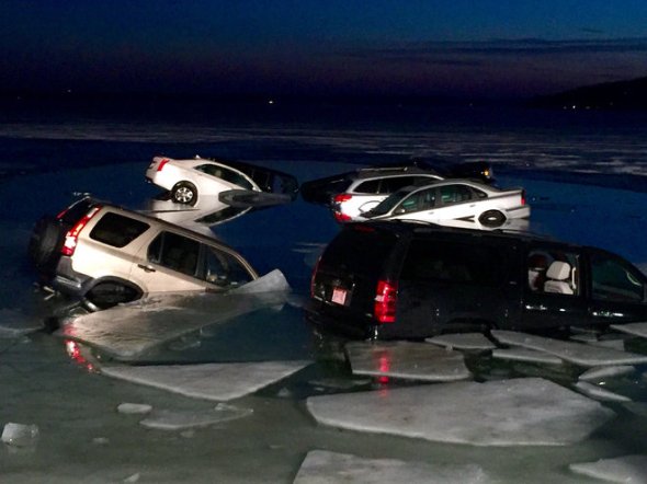 2/6/16 Milwaukee Journal Sentinel - Cars remain submerged in Geneva Lake in the twilight hours Saturday.
